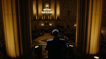 Movie still from “Mr. Robot” (2015), created by Sam Esmail – A man standing in front of an audience in a theater; Extreme Wide shot, Low angle