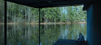 Movie still from “Ozark” (2017), created by Bill Dubuque – A view of a body of water from a boat dock; Extreme Wide shot, High angle