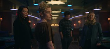 Movie still from “Ozark” (2017), created by Bill Dubuque – A woman standing next to a man in a room; Medium shot, Low angle