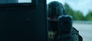 Movie still from “Ozark” (2017), created by Bill Dubuque – A man wearing a helmet is looking out of a window; Close Up shot, Over the shoulder angle