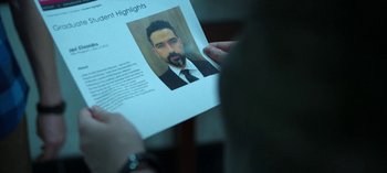 Movie still from “Ozark” (2017), created by Bill Dubuque – A person holding up a paper with a picture of a man's face on it; Extreme Close Up shot, Overhead angle
