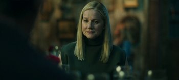 Movie still from “Ozark” (2017), created by Bill Dubuque – A woman with blonde hair wearing a green sweater; Close Up shot, Over the shoulder angle