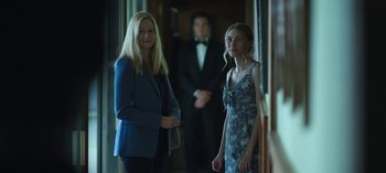 Movie still from “Ozark” (2017), created by Bill Dubuque – Two women and a man standing in front of a doorway; Medium shot, Over the shoulder angle