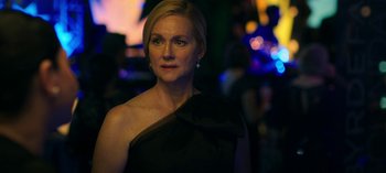 Movie still from “Ozark” (2017), created by Bill Dubuque – A woman in a black dress is looking at the camera; Close Up shot, Over the shoulder angle