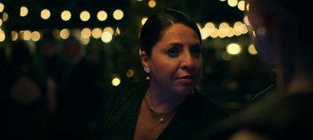 Movie still from “Ozark” (2017), created by Bill Dubuque – A person wearing a necklace; Close Up shot, Over the shoulder angle