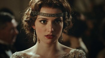 Movie still from “Peaky Blinders” (2013), created by Steven Knight – A person wearing a tiara; Close Up shot, Over the shoulder angle