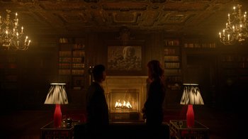 Movie still from “Mr. Robot” (2015), created by Sam Esmail – Two women sitting in front of a fire place; Wide shot, Low angle