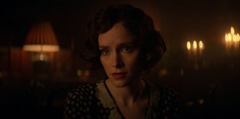 Movie still from “Peaky Blinders” (2013), created by Steven Knight – A person with short hair; Close Up shot, Over the shoulder angle