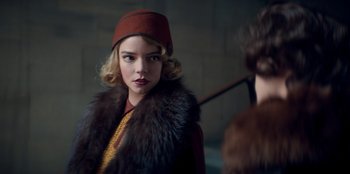 Movie still from “Peaky Blinders” (2013), created by Steven Knight – A woman in a fur coat and a red hat; Close Up shot, Low angle