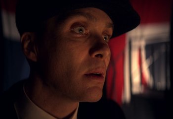 Movie still from “Peaky Blinders” (2013), created by Steven Knight – A person wearing a hat; Close Up shot, Low angle