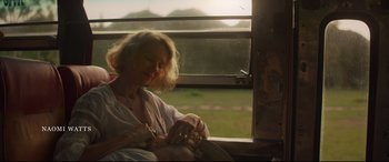 Movie still from “Penguin Bloom” (2020), directed by Glendyn Ivin – A woman sitting on a train looking out the window; Medium shot, Low angle