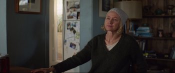 Movie still from “Penguin Bloom” (2020), directed by Glendyn Ivin – A woman wearing a white hat and a green sweater; Medium shot, Over the shoulder angle