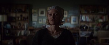 Movie still from “Penguin Bloom” (2020), directed by Glendyn Ivin – A woman wearing a white hat in a dark room; Close Up shot, Over the shoulder angle