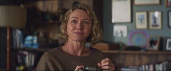 Movie still from “Penguin Bloom” (2020), directed by Glendyn Ivin – A person holding a camera in a room; Close Up shot, Over the shoulder angle