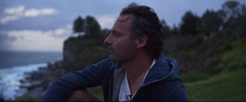 Movie still from “Penguin Bloom” (2020), directed by Glendyn Ivin – A person wearing a jacket; Close Up shot, Over the shoulder angle
