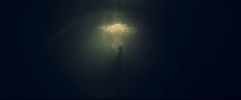 Movie still from “Penguin Bloom” (2020), directed by Glendyn Ivin – A person sitting on a chair in the middle of the ocean; Wide shot, Low angle