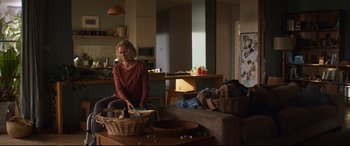 Movie still from “Penguin Bloom” (2020), directed by Glendyn Ivin – A woman sitting on a chair in a living room; Wide shot, Over the shoulder angle