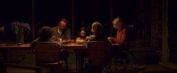 Movie still from “Penguin Bloom” (2020), directed by Glendyn Ivin – A group of people sitting around a table eating; Wide shot, High angle