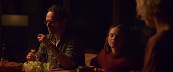 Movie still from “Penguin Bloom” (2020), directed by Glendyn Ivin – A man and a woman sitting at a dinner table; Medium shot, Over the shoulder angle