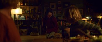 Movie still from “Penguin Bloom” (2020), directed by Glendyn Ivin – A girl in a red shirt is playing a game; Medium shot, Over the shoulder angle