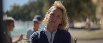Movie still from “Penguin Bloom” (2020), directed by Glendyn Ivin – A woman with blonde hair wearing a white shirt and a blue jacket; Close Up shot, Over the shoulder angle