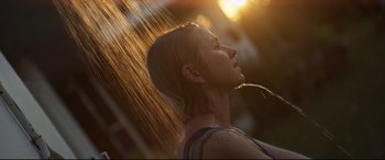 Movie still from “Penguin Bloom” (2020), directed by Glendyn Ivin – A person under a rain shower; Close Up shot, Low angle