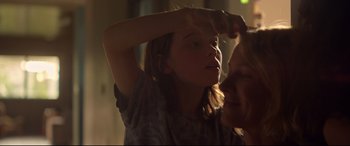 Movie still from “Penguin Bloom” (2020), directed by Glendyn Ivin – A young girl is looking into the mirror; Close Up shot, Over the shoulder angle