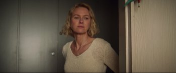 Movie still from “Penguin Bloom” (2020), directed by Glendyn Ivin – A woman wearing a white shirt and a white sweater; Close Up shot, Low angle