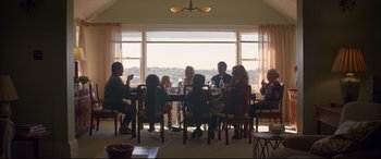 Movie still from “Penguin Bloom” (2020), directed by Glendyn Ivin – A group of people sitting at a table with wine glasses; Wide shot, Low angle