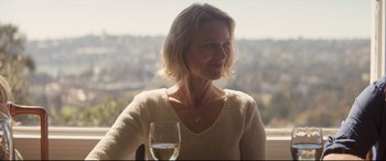 Movie still from “Penguin Bloom” (2020), directed by Glendyn Ivin – A woman sitting at a table with a glass of wine; Close Up shot, Over the shoulder angle