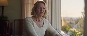 Movie still from “Penguin Bloom” (2020), directed by Glendyn Ivin – A woman sitting in front of a window looking sad; Close Up shot, Over the shoulder angle