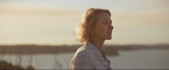Movie still from “Penguin Bloom” (2020), directed by Glendyn Ivin – A woman standing in front of a body of water; Close Up shot, Over the shoulder angle