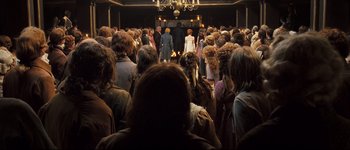 Movie still from “Pride & Prejudice” (2005), directed by Joe Wright – A group of people standing in front of a crowd; Wide shot, High angle
