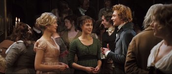 Movie still from “Pride & Prejudice” (2005), directed by Joe Wright – A group of people standing next to each other in a room; Medium shot, Over the shoulder angle