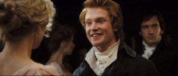 Movie still from “Pride & Prejudice” (2005), directed by Joe Wright – A person wearing a suit and tie; Close Up shot, Over the shoulder angle