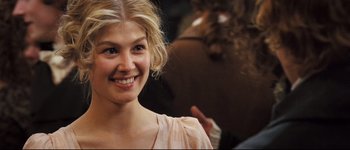 Movie still from “Pride & Prejudice” (2005), directed by Joe Wright – A beautiful young lady smiling for the camera; Close Up shot, Over the shoulder angle