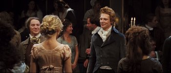 Movie still from “Pride & Prejudice” (2005), directed by Joe Wright – A group of people standing next to each other in a room; Medium shot, Over the shoulder angle