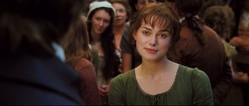 Movie still from “Pride & Prejudice” (2005), directed by Joe Wright – A person wearing a green shirt; Close Up shot, Over the shoulder angle