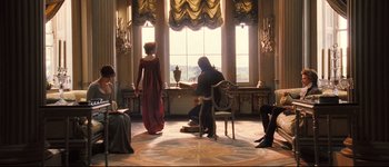 Movie still from “Pride & Prejudice” (2005), directed by Joe Wright – A man and a woman are standing in front of a window; Wide shot, High angle