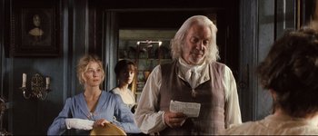 Movie still from “Pride & Prejudice” (2005), directed by Joe Wright – A group of people standing next to each other in a room; Medium shot, Over the shoulder angle