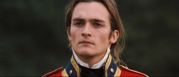 Movie still from “Pride & Prejudice” (2005), directed by Joe Wright – A person wearing a military uniform; Close Up shot, Over the shoulder angle