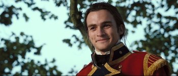 Movie still from “Pride & Prejudice” (2005), directed by Joe Wright – A person wearing a uniform near a tree; Close Up shot, Over the shoulder angle