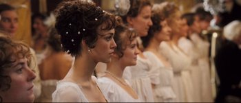 Movie still from “Pride & Prejudice” (2005), directed by Joe Wright – A group of women standing in a line wearing white dresses; Close Up shot, Over the shoulder angle