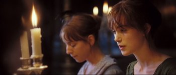 Movie still from “Pride & Prejudice” (2005), directed by Joe Wright – Two young women standing next to each other in a room; Close Up shot, Over the shoulder angle