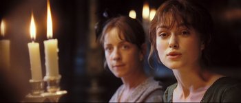 Movie still from “Pride & Prejudice” (2005), directed by Joe Wright – Two young women standing next to each other in a room; Close Up shot, Over the shoulder angle