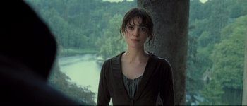 Movie still from “Pride & Prejudice” (2005), directed by Joe Wright – A woman standing in front of a body of water; Close Up shot, Over the shoulder angle