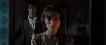 Movie still from “Pride & Prejudice” (2005), directed by Joe Wright – A young woman with dark hair standing in front of a man; Close Up shot, Over the shoulder angle