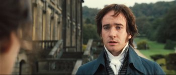 Movie still from “Pride & Prejudice” (2005), directed by Joe Wright – A man in a blue coat and a white shirt; Close Up shot, Over the shoulder angle