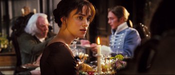 Movie still from “Pride & Prejudice” (2005), directed by Joe Wright – A woman sitting in front of a table holding a candle; Close Up shot, Over the shoulder angle