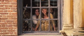 Movie still from “Pride & Prejudice” (2005), directed by Joe Wright – A group of people looking out of a window; Medium shot, High angle